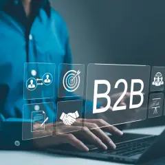 Biznes do biznesu (B2B) to klucz do rozwoju. Ikony symbolizują współpracę, cele, umowy, globalny zasięg i efektywność.