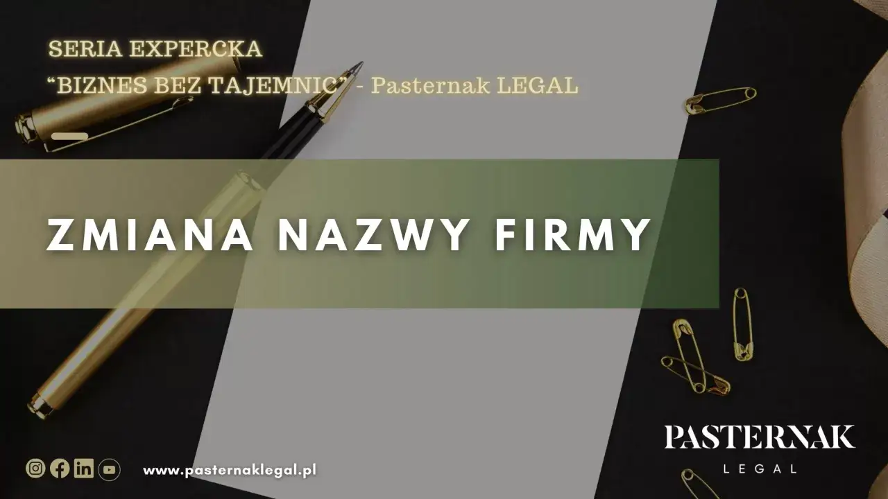 Złoty długopis i agrafki na ciemnym tle. Napis 